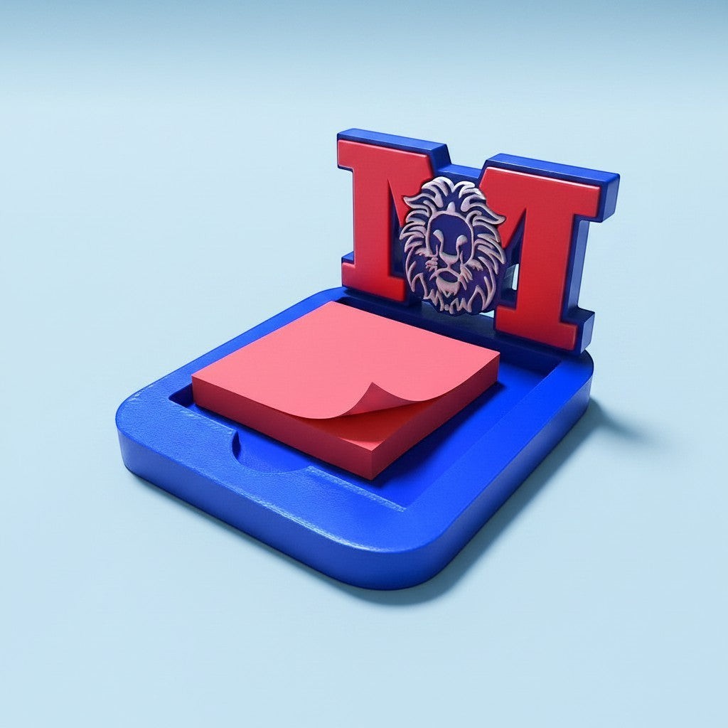 Xpress It Graphics blue and red 3D printed sticky note holder with Monarch M and lion logo. Holds a stack of pink sticky notes.